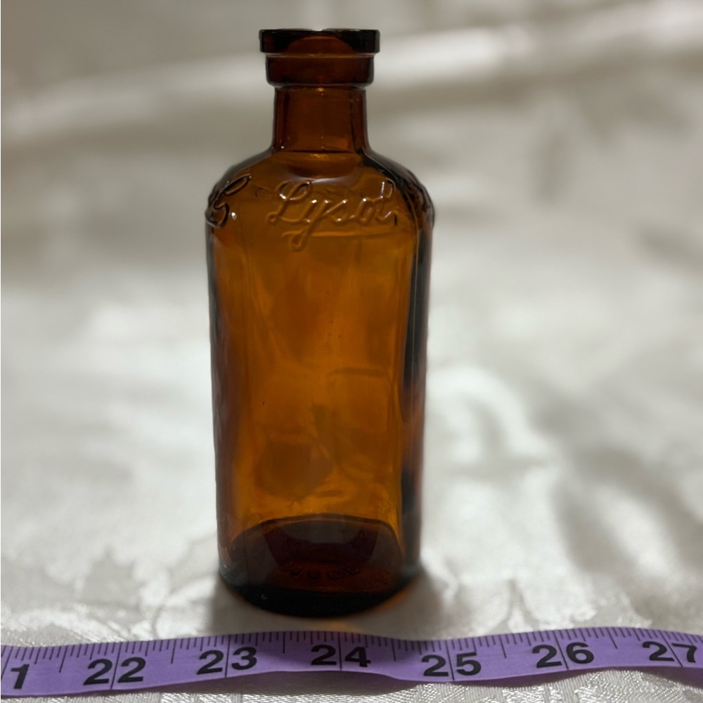 Antique Amber Glass Bottle with Embossed Details